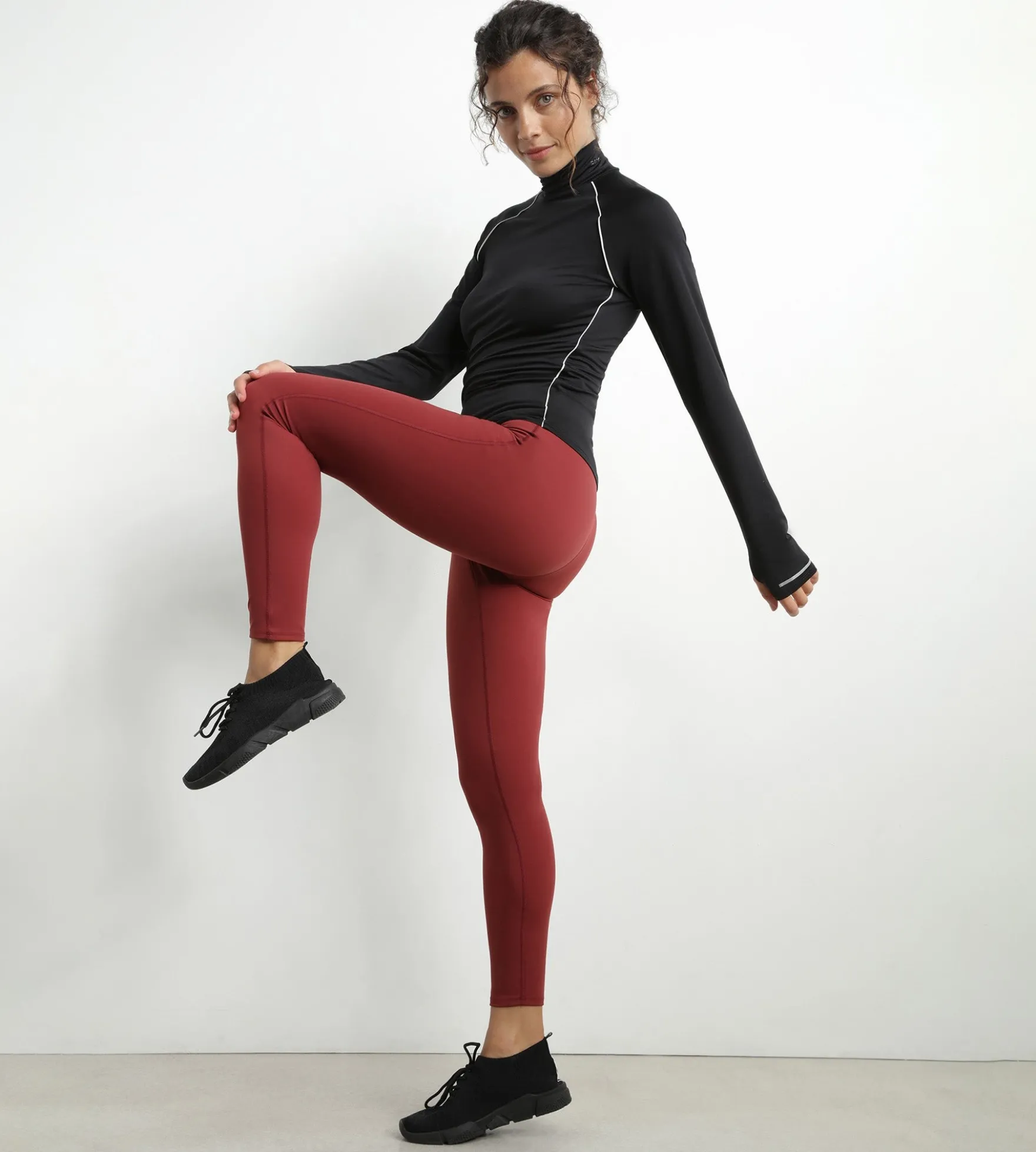 Haut de sport femme à col montant en microfibre noire Dim Move